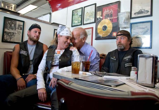 Biden seems to be groping a customer while at a campaign stop