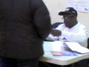 In Chicago, one jackass Chicago poll worker actually sat there wearing an Obama hat while checking voters in.