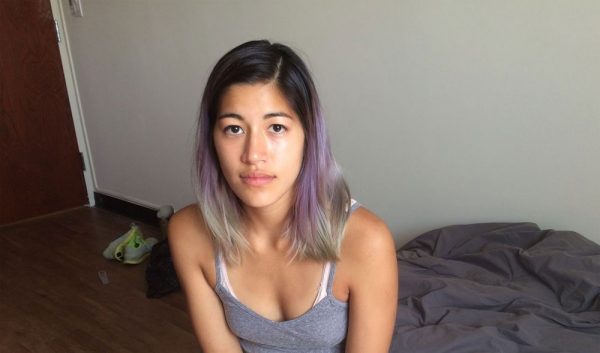 Emma Sulkowicz poses with a mattress she carried everywhere she went in protest of Columbia’s university’s alleged lack of action after she reported being ‘raped’. September 5, 2014 in New York City.